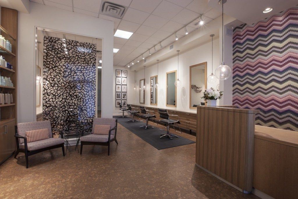 Our Andersonville Salon location and the front desk with waiting area